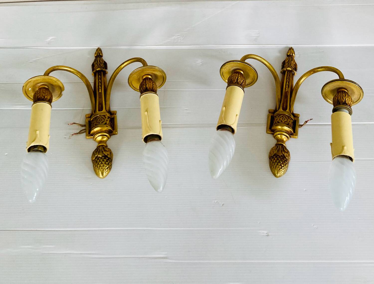 St Louis XVI gilded bronze wall lights with foliage and pine cone decorations