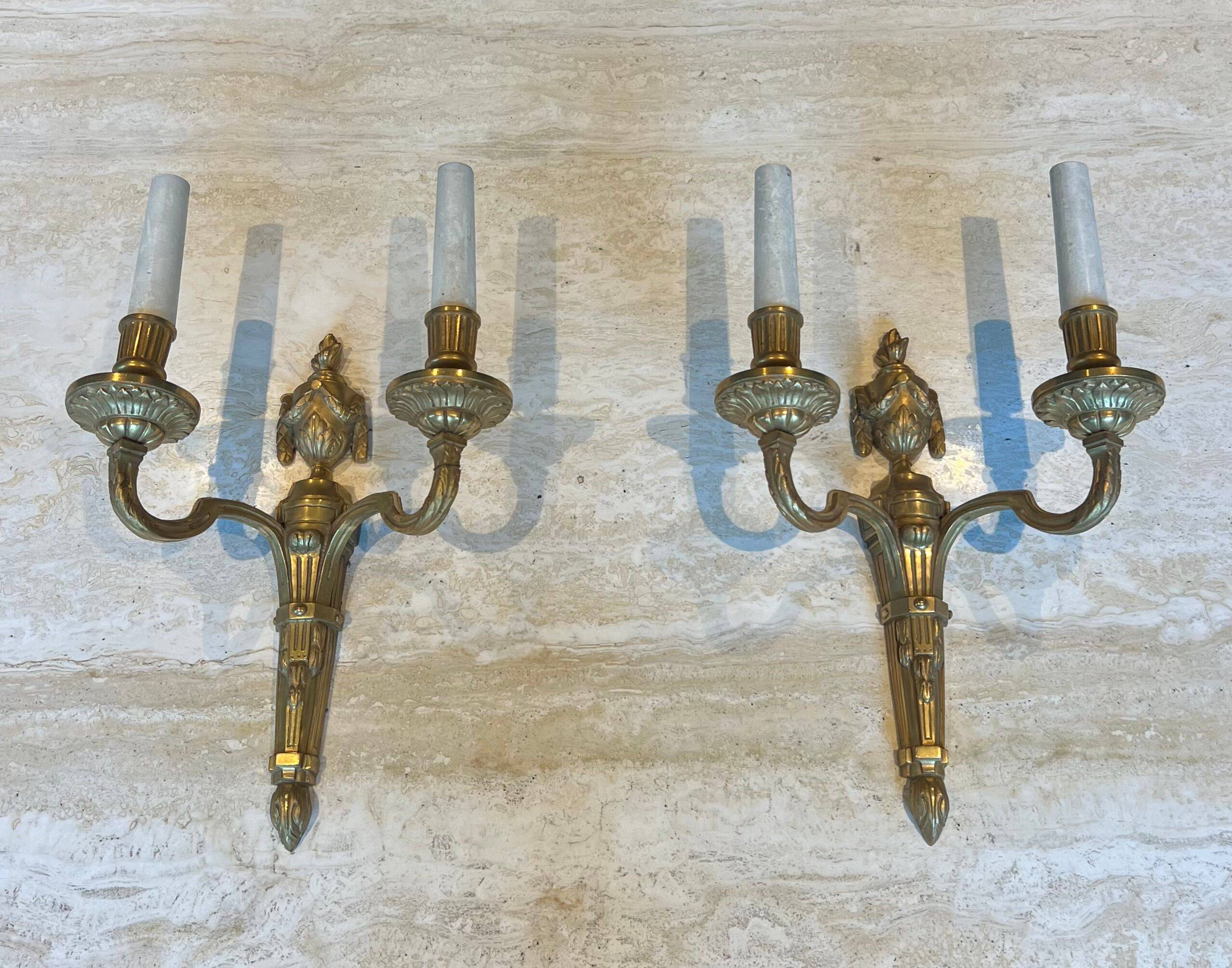 Set of 4 bronze wall lights in Louis XVI style.