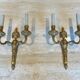 Suite de 4 appliques en bronze de style Louis XVI