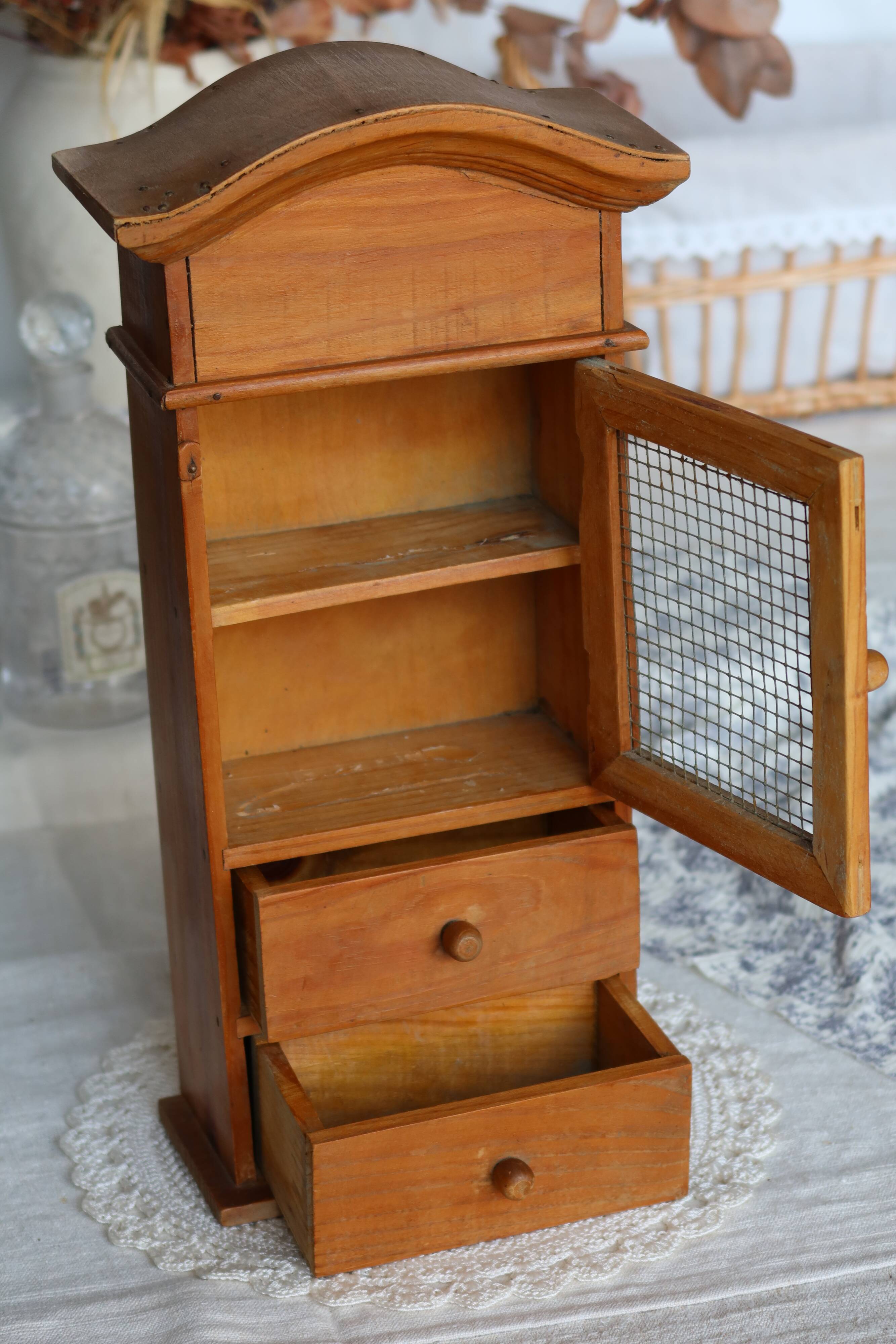 Vintage wooden shelf with drawers and wire mesh door
