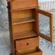 Vintage wooden shelf with drawers and wire mesh door