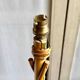 Rattan lamp post base with magazine holder