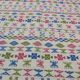 White carpet with Berber motifs pink green and blue