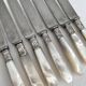 Antique table knives in mother-of-pearl and silver-plated metal