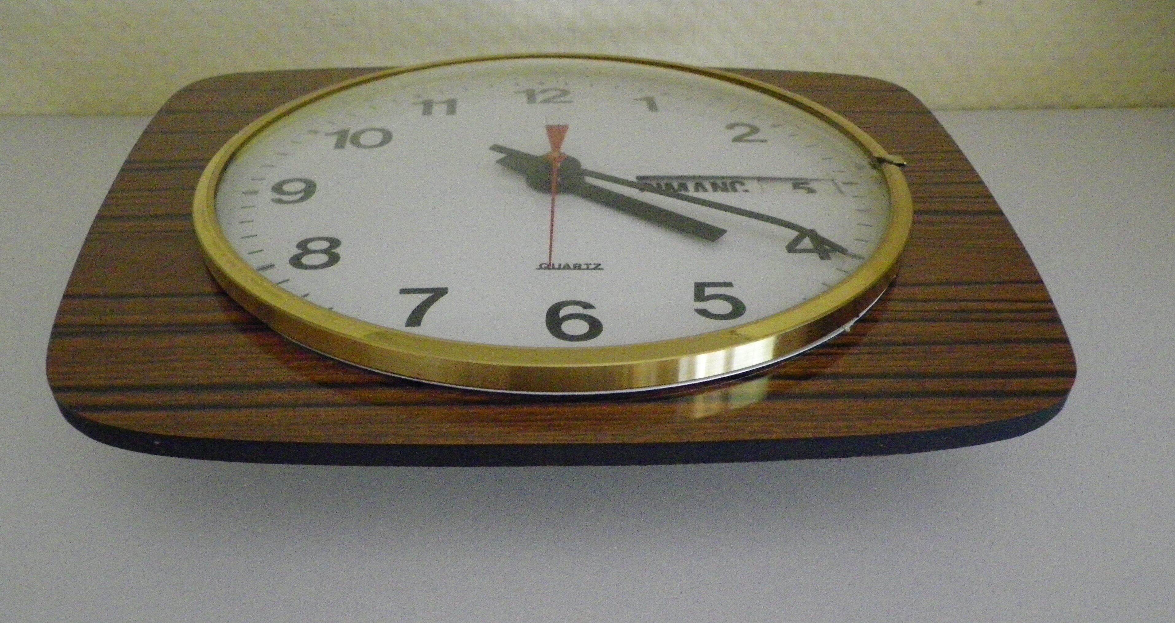 Formica wall clock with day and date - 1970s