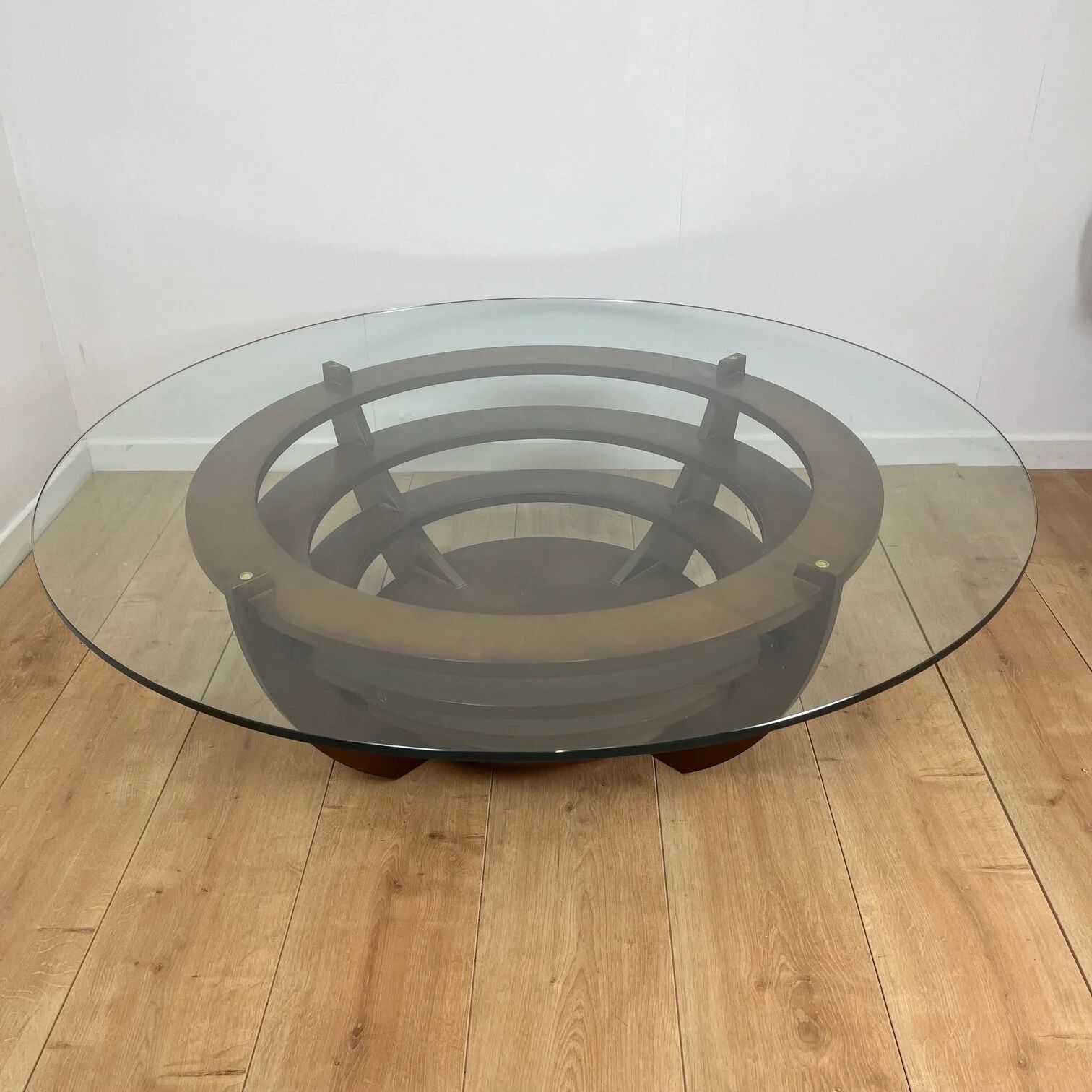 Sculptural coffee table with concentric rings, glass and wood, circa 1985.