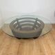 Sculptural coffee table with concentric rings, glass and wood, circa 1985.