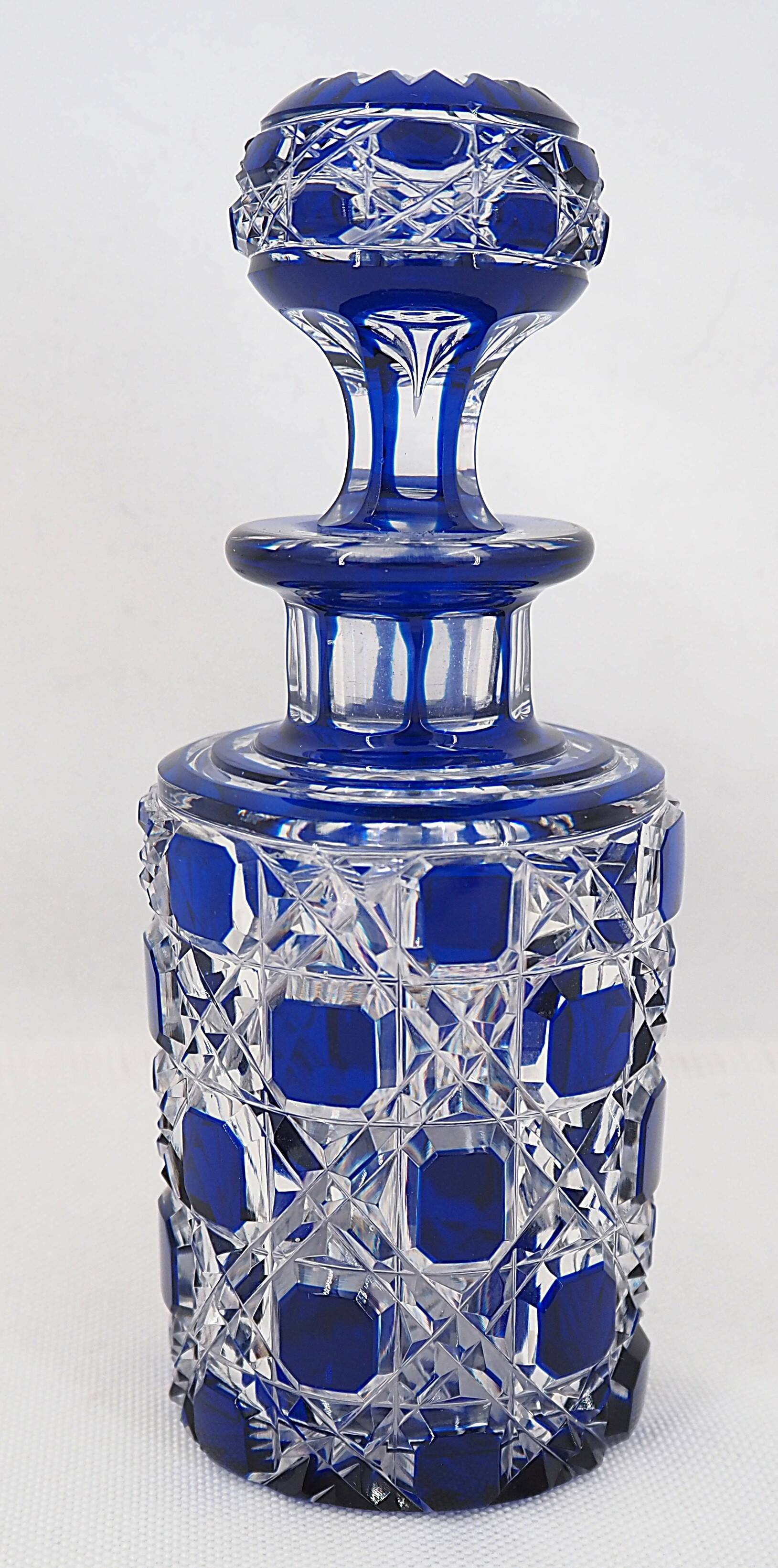 Baccarat, cut crystal bottle, blue lined, diamond gemstones, 14.8 cm.