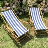 Pair of wooden deck chairs with armrests in blue bayadere fabric