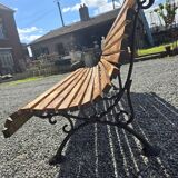 Wooden garden bench with cast iron base