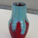An emailed ceramic vase in turquoise and red, design and vintage