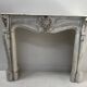 Louis XV style fireplace in veined white Carrara marble, 19th century.