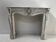 Louis XV style fireplace in veined white Carrara marble, 19th century.