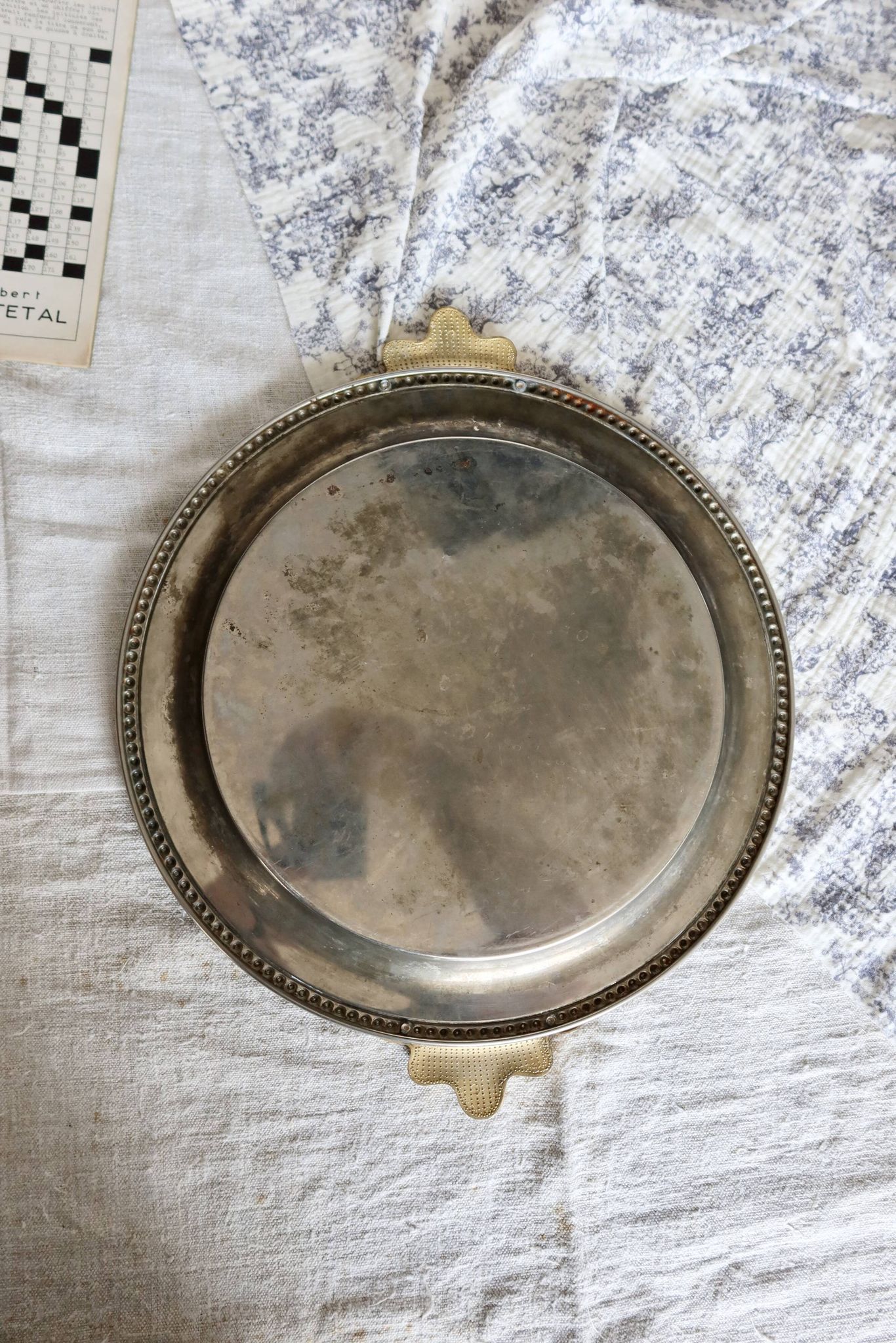 Vintage round silver metal serving tray with gold knot handles