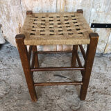 Wooden stool with woven rope seat