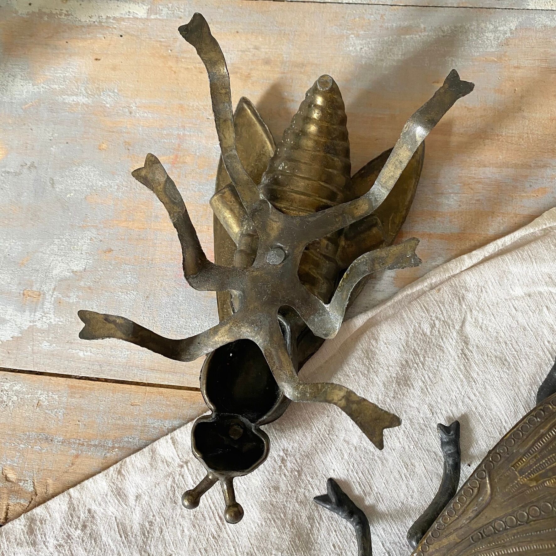 2 metal ashtrays with insect fly designs from the 1950s-60s.
