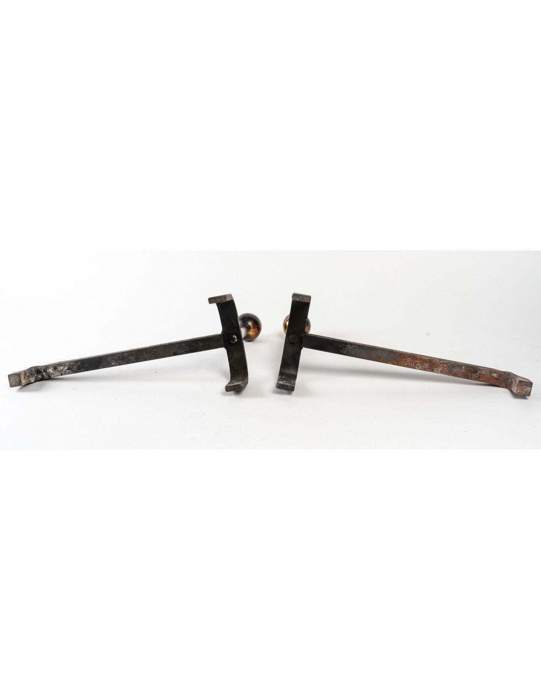 Pair of cast iron and brass chenets, 1960