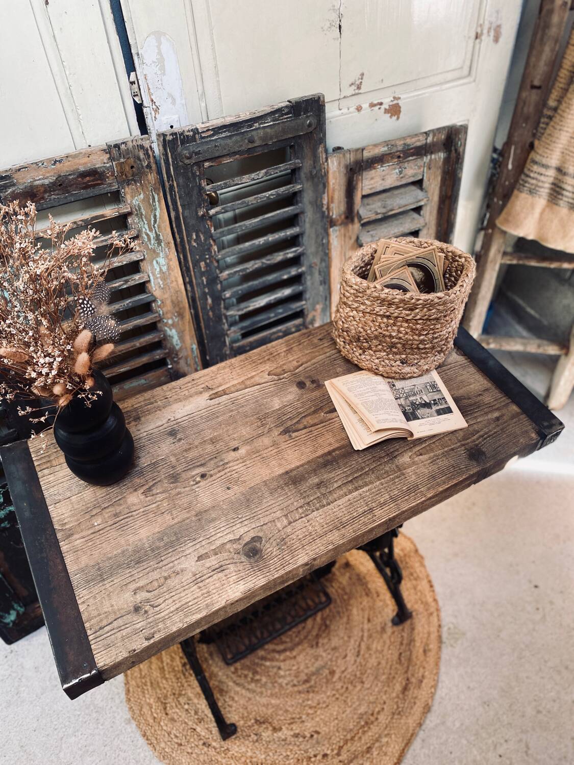 Vintage wooden table with a cast iron base.