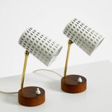 A pair of mid-century modern bedside lamps with perforated metal shades