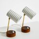 A pair of mid-century modern bedside lamps with perforated metal shades