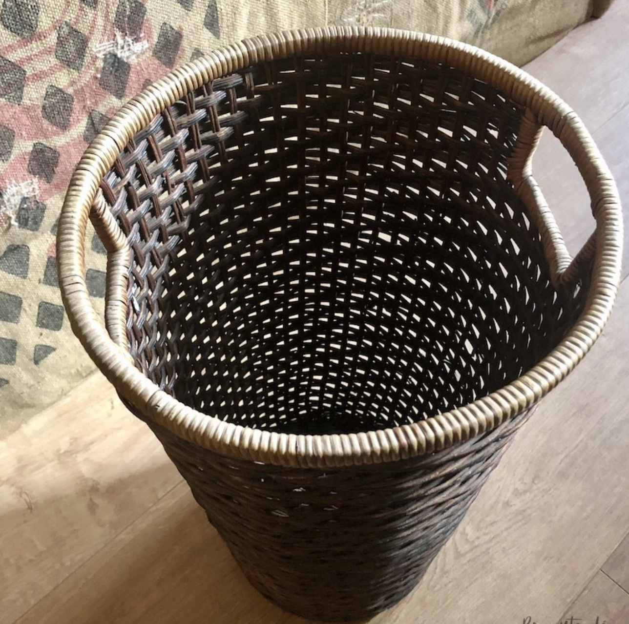 High basket in braided wicker