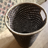 High basket in braided wicker