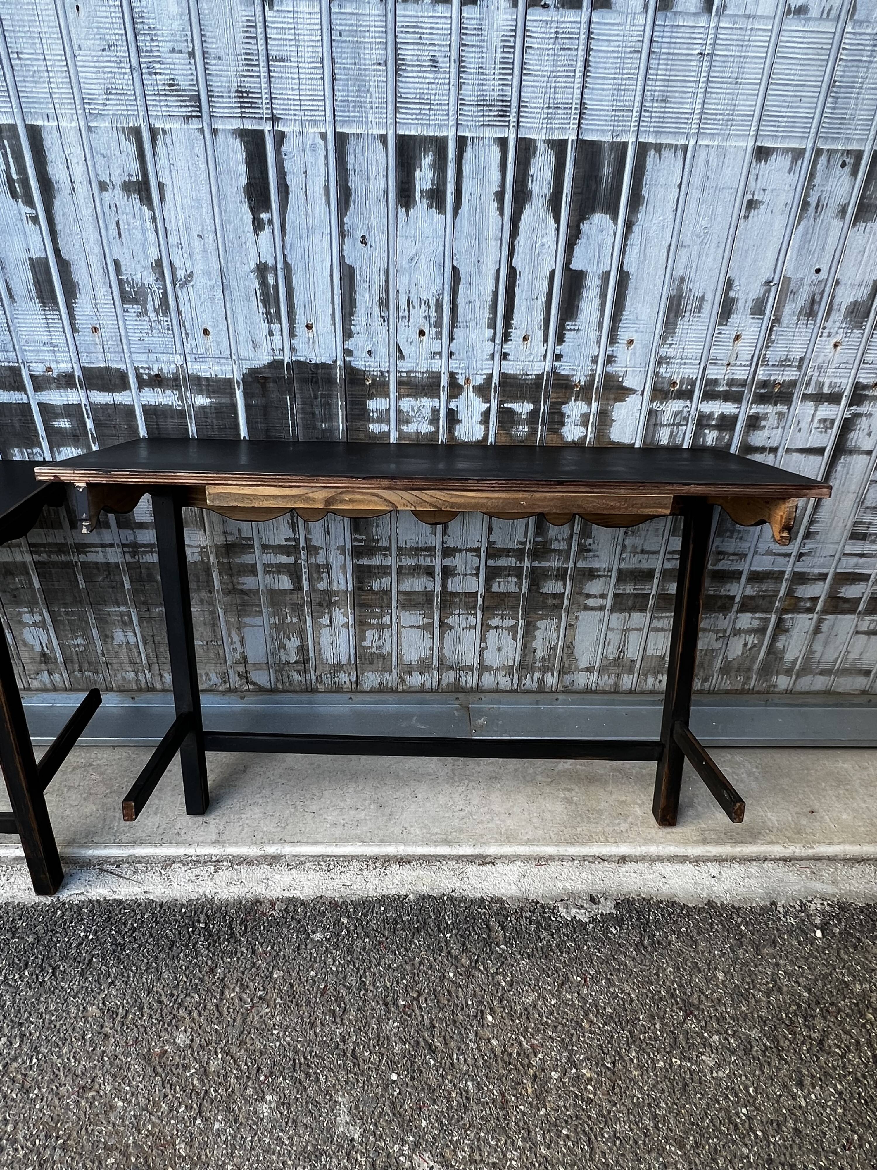 Pair of black patinated consoles