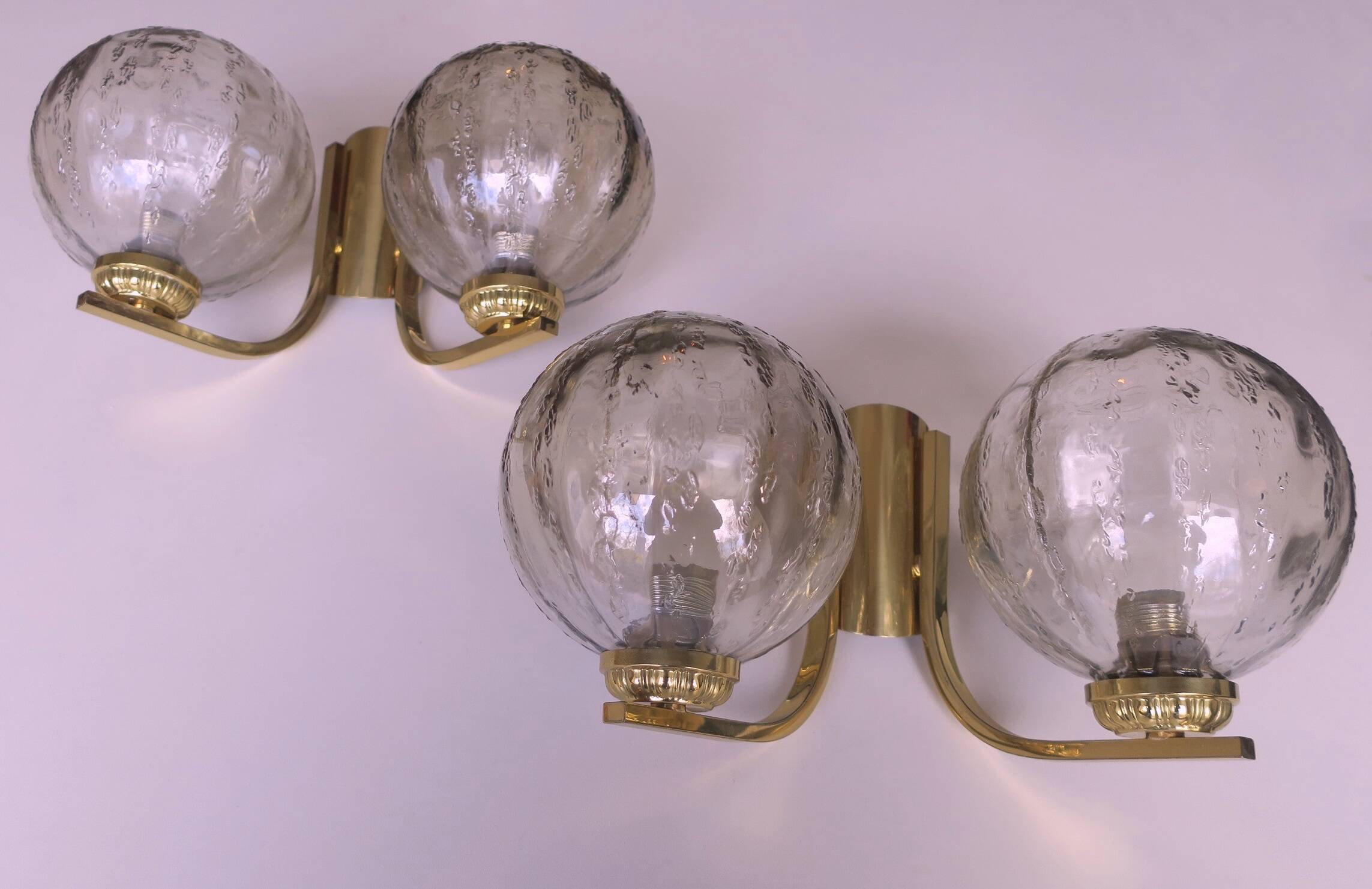 Mid century pair of brass and glass double wall lights, 1970s