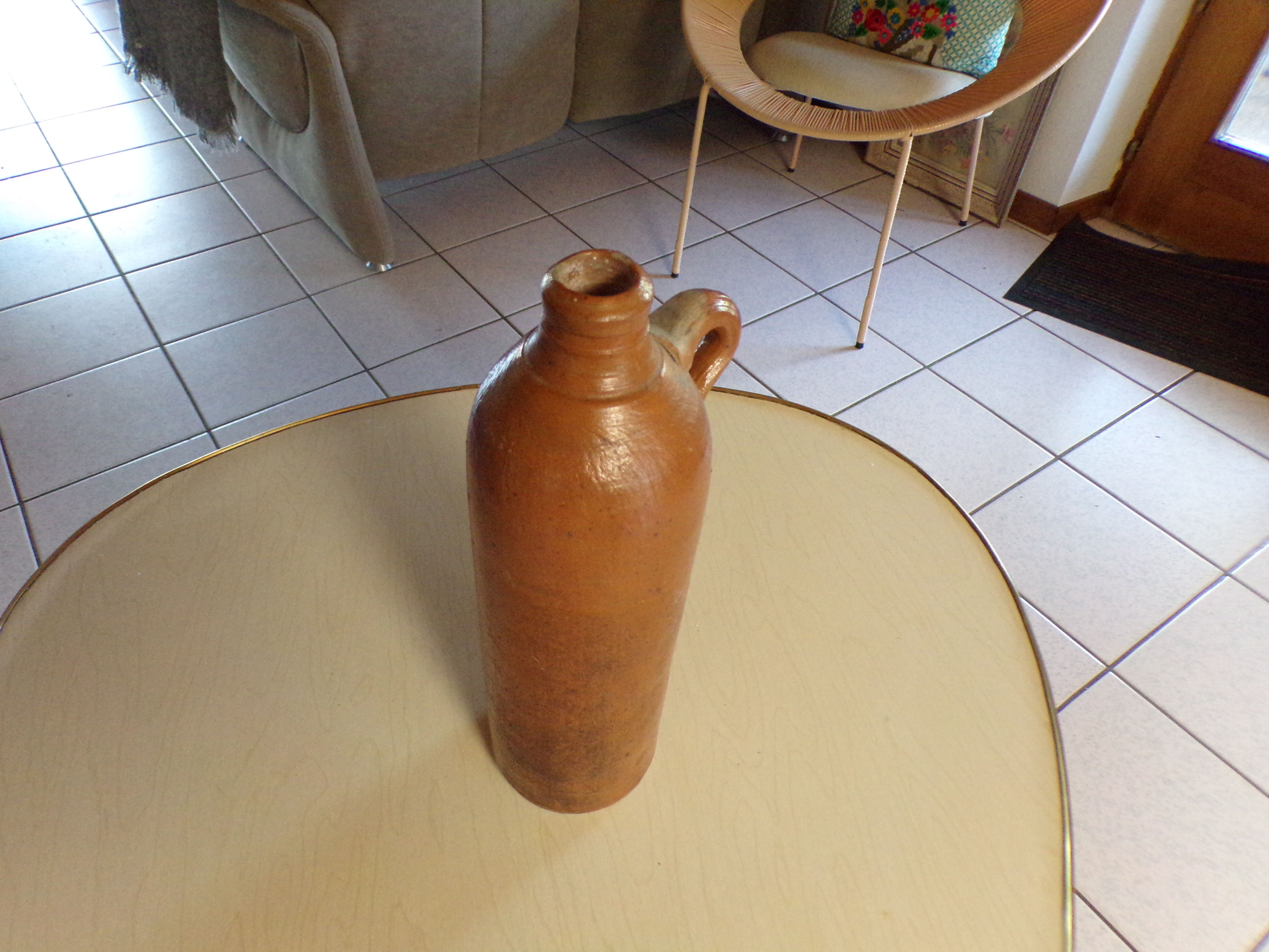 Old glazed terracotta bottle