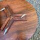 Round folding side table made of carved solid wood.