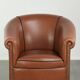 Cowhide club armchair in English style with comfortable seating.