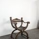 Curule chair Dagobert in carved walnut with lion heads.