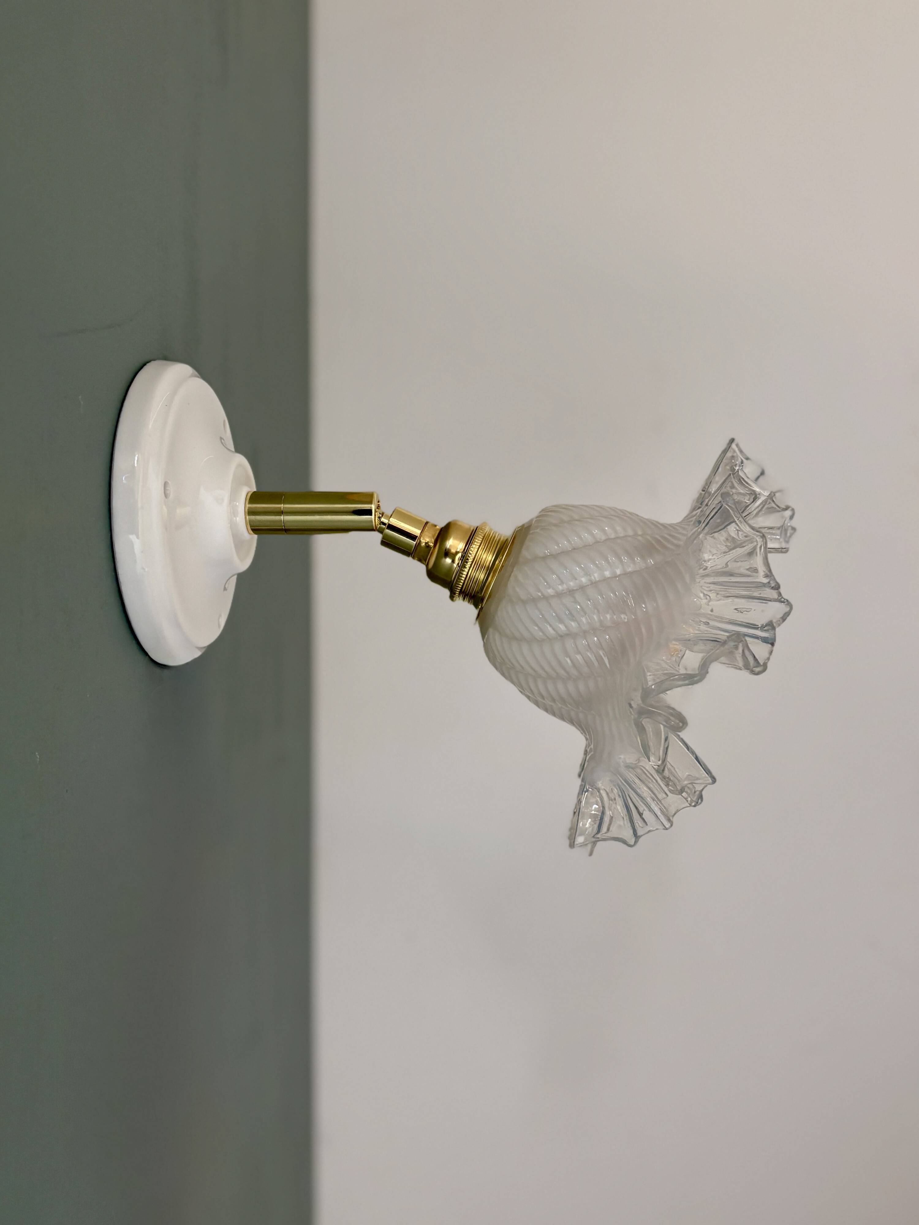 Vintage tulip glass wall light in transparent, slightly pearlescent white.