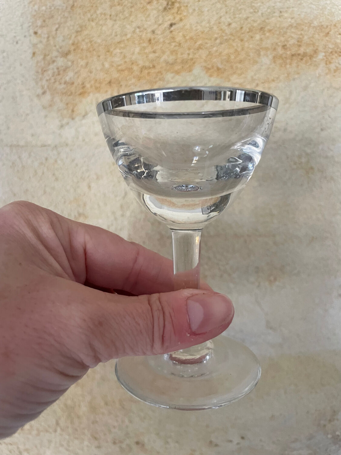 Set of 8 stemmed port glasses with silver trim.