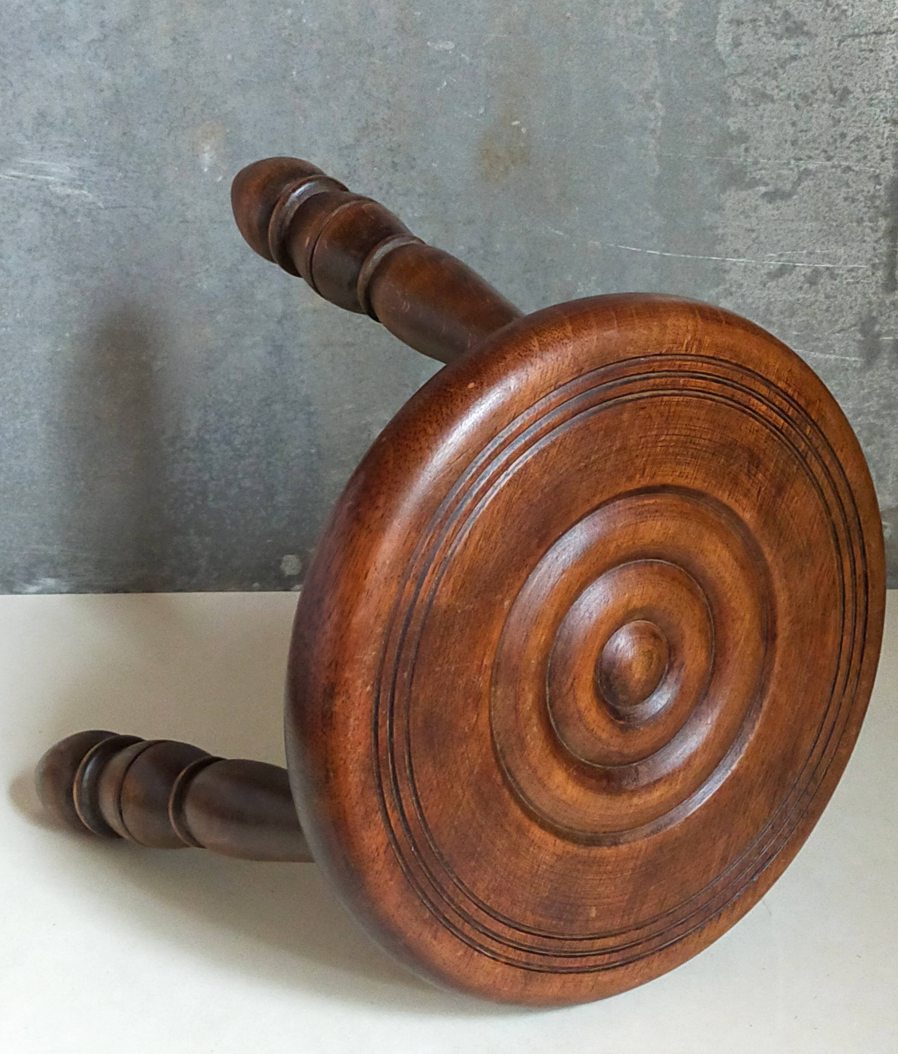 Low tripod stool in vintage turned solid wood