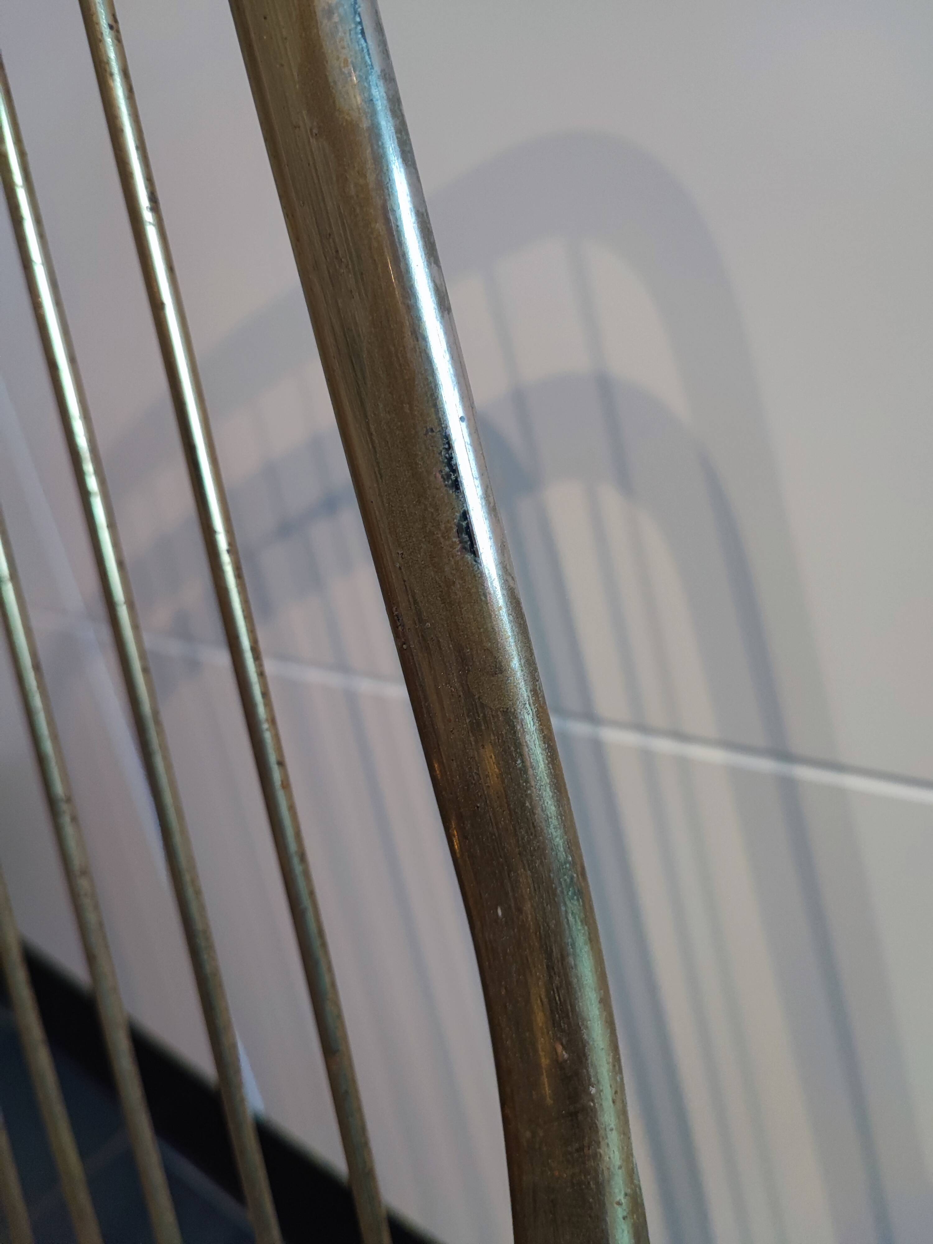 Tubular metal chair covered with gilding