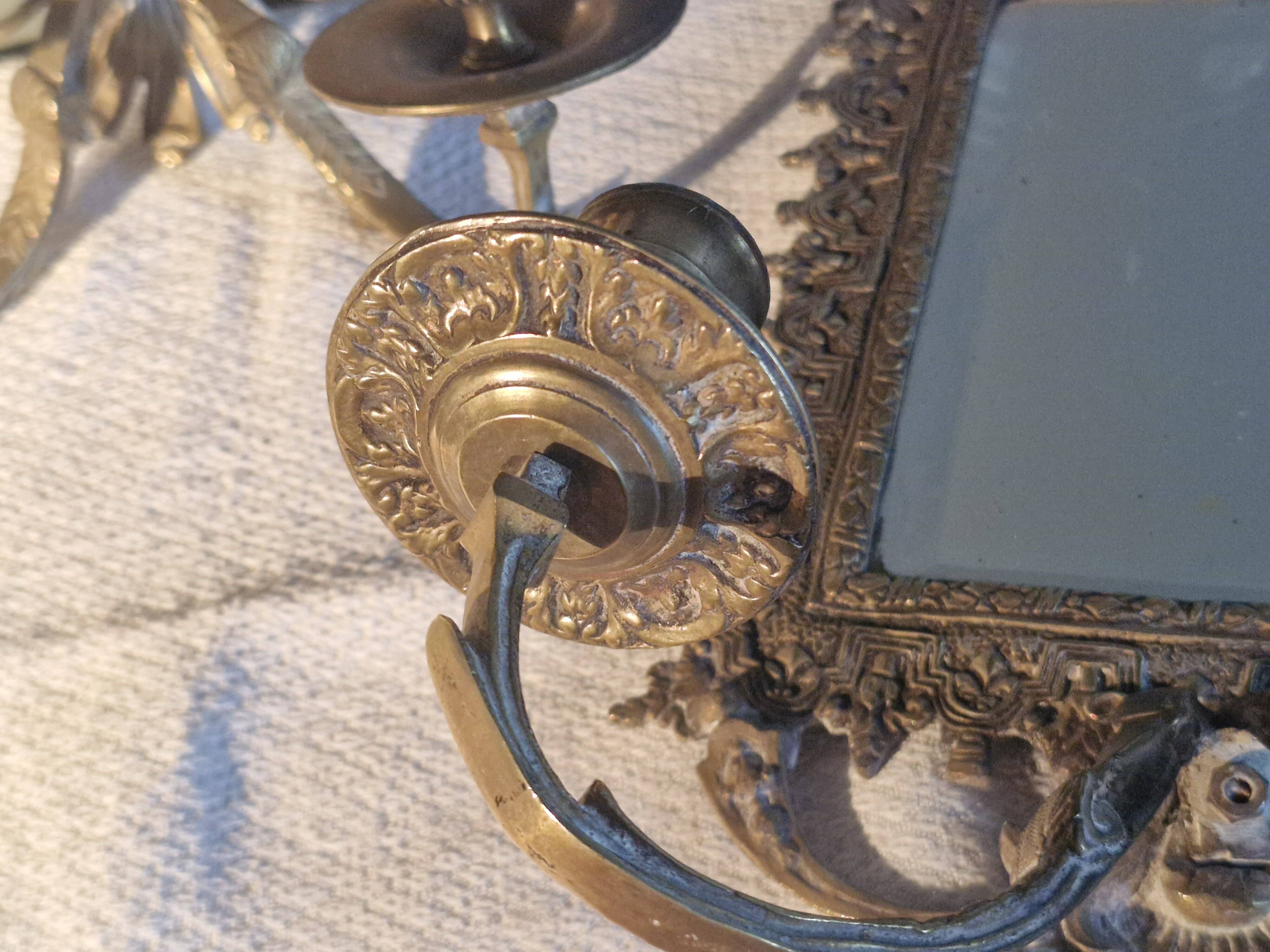 Pair of mirror sconces/candle holders in 19th-century bronze.