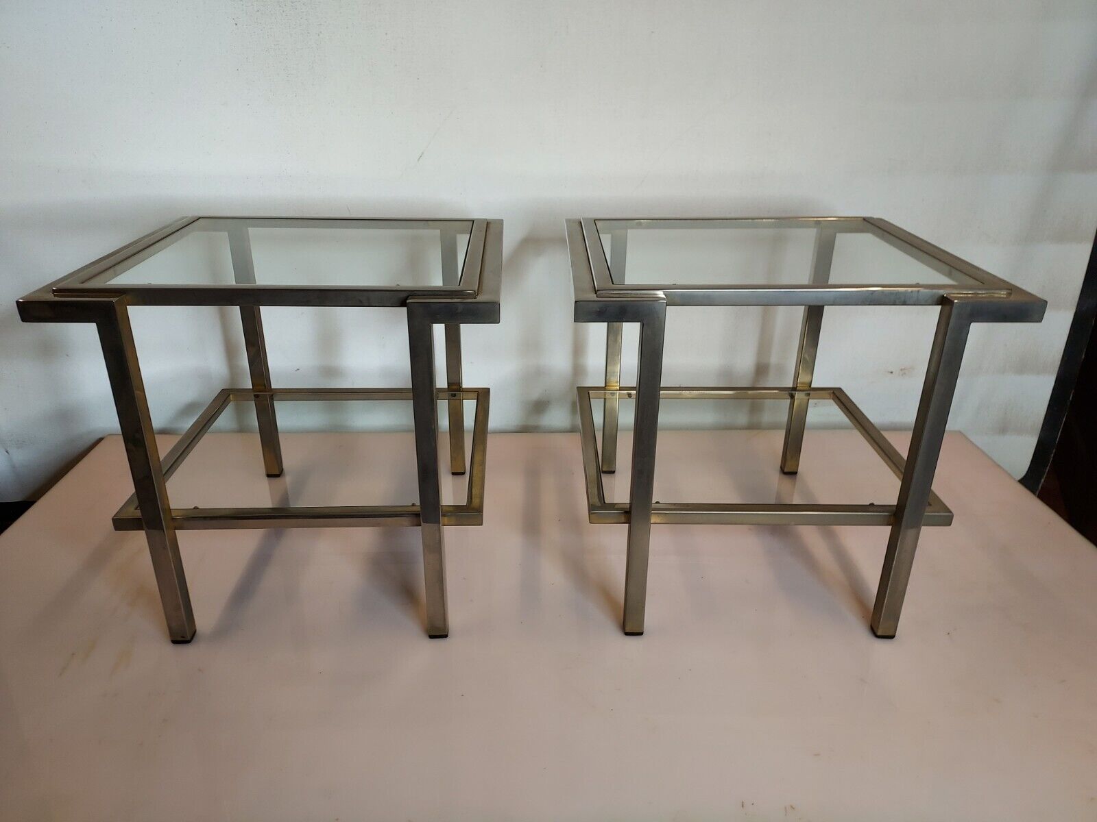 Pair of end of sofas in brushed iron signed Guy Lefevre