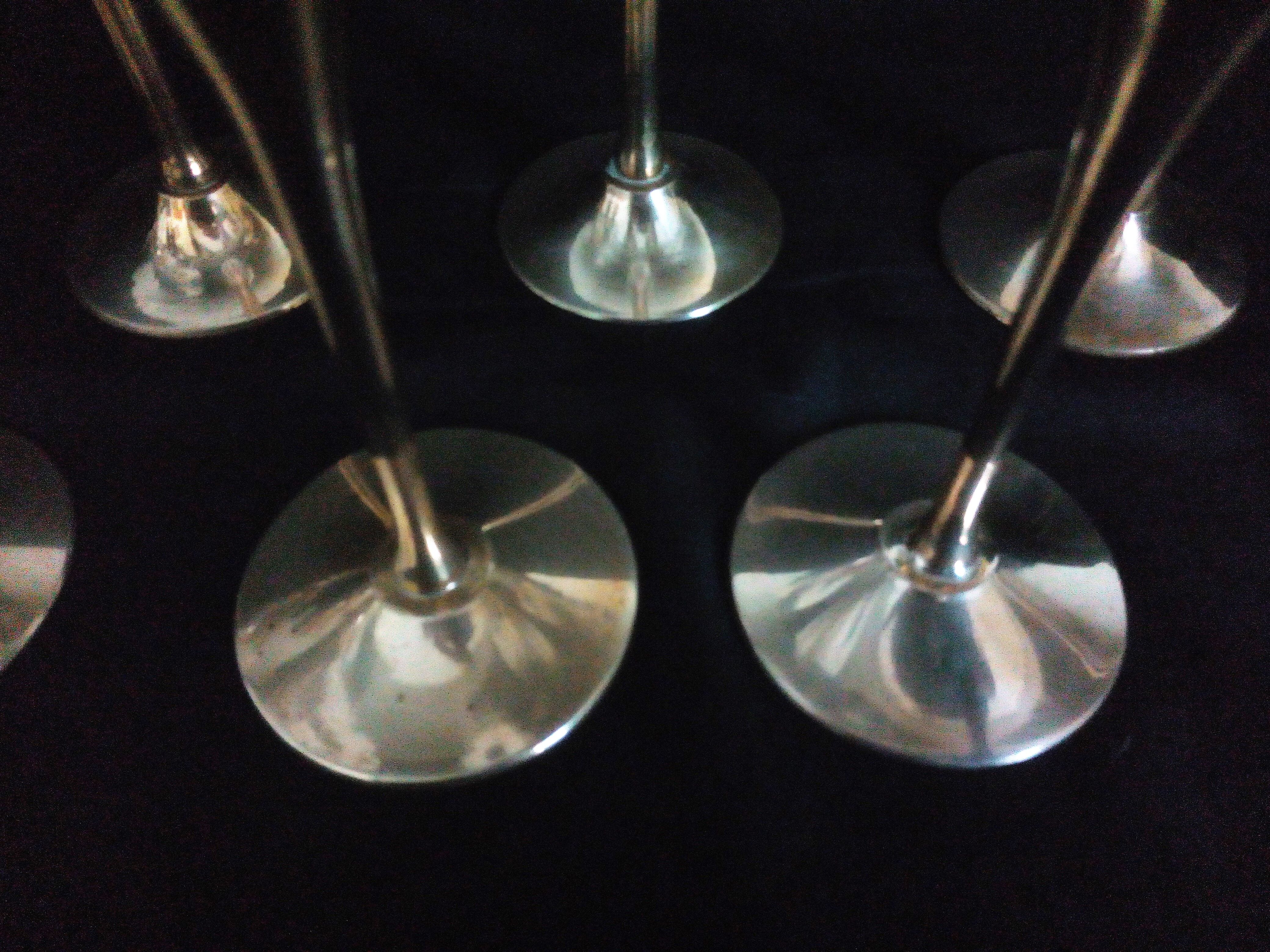 Lot of 12 silver metal flutes on brass stand