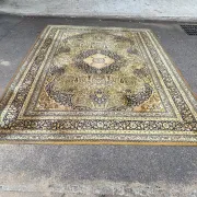 Large Persian wool rug 250x350 cm in gold and navy blue.