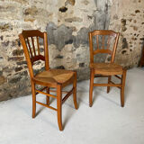 Set of 2 antique wooden and straw chairs.