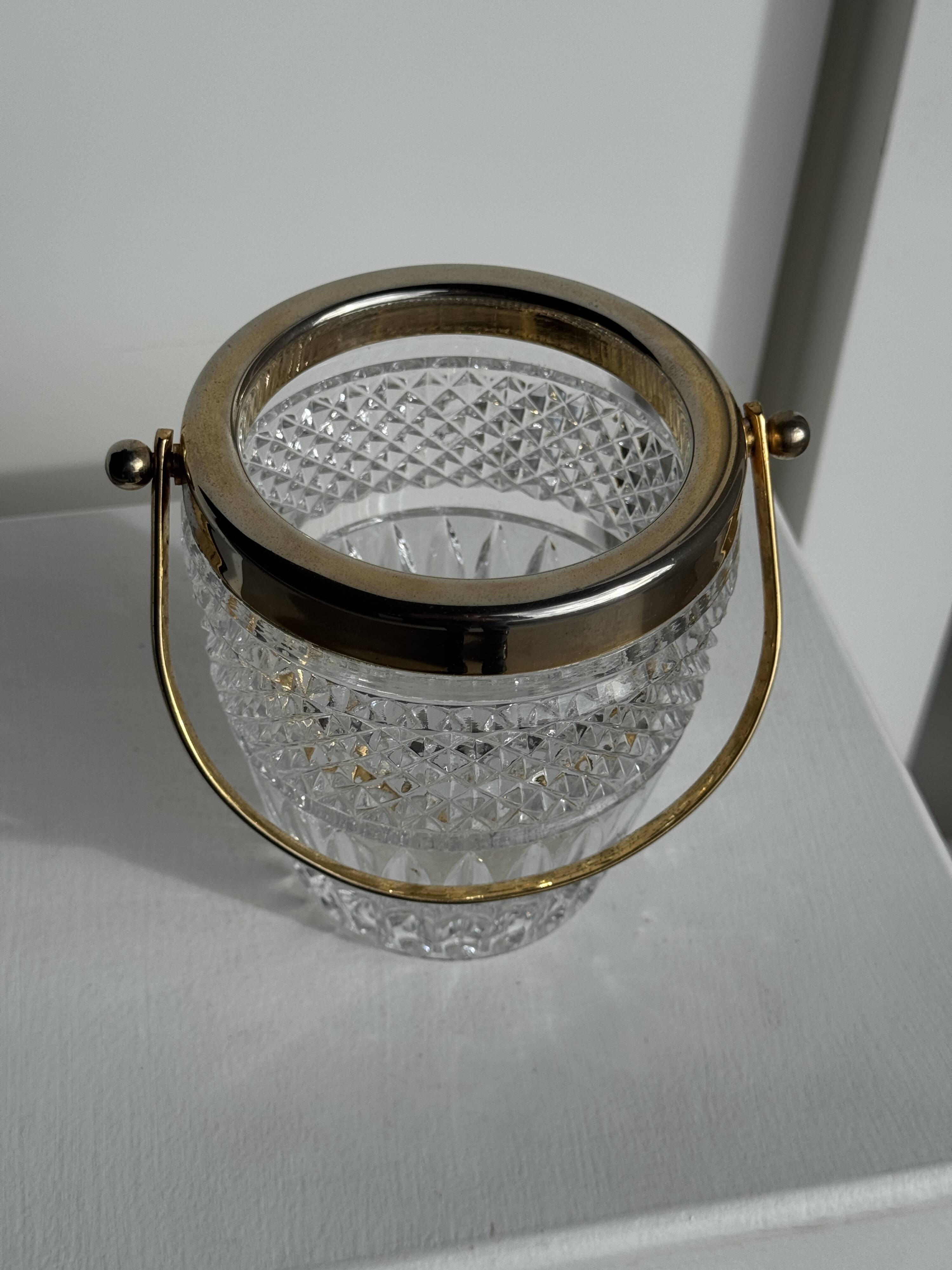 Small golden glass ice bucket with diamond point design and its scoop.