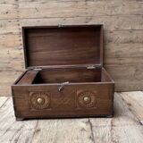 Teak chest from Burma with carved rosettes.