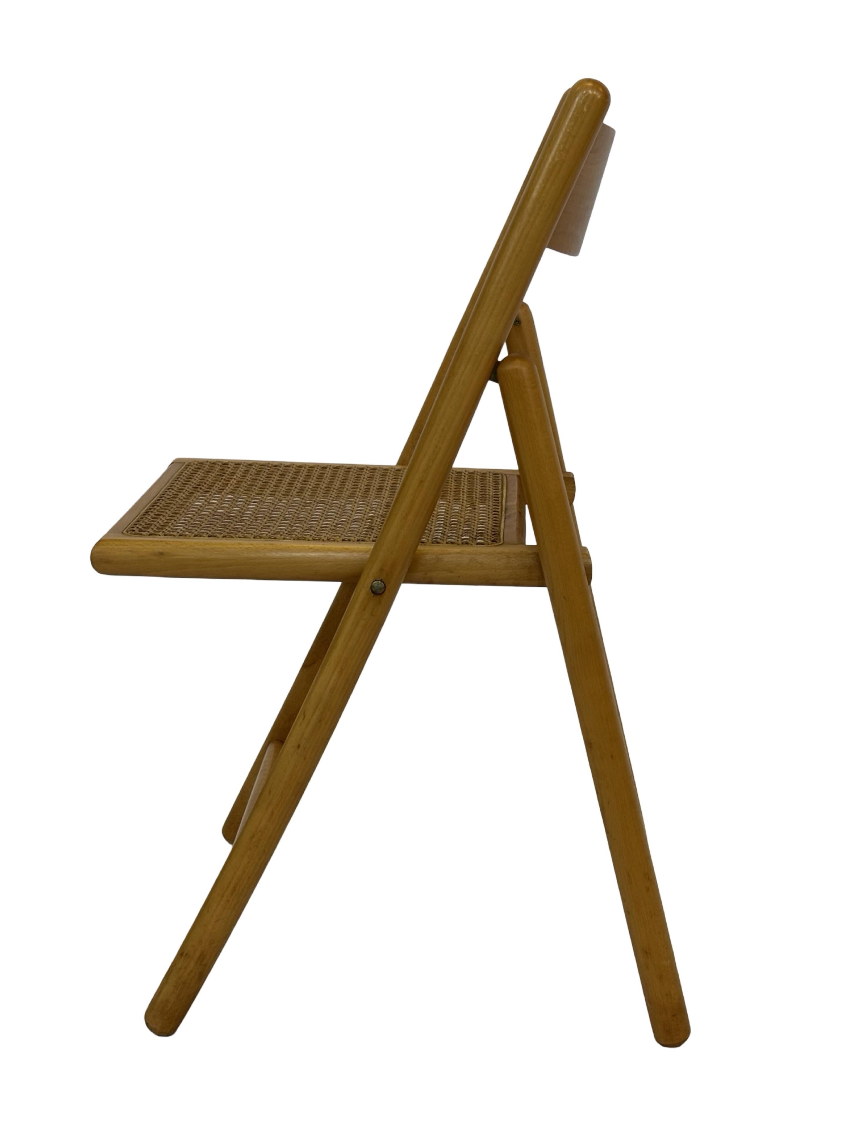 Vintage wooden folding chair with rattan seat 80s minimalist design