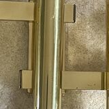 Tubular wall sconces in brass, Italian design from the 1970s, attributed.