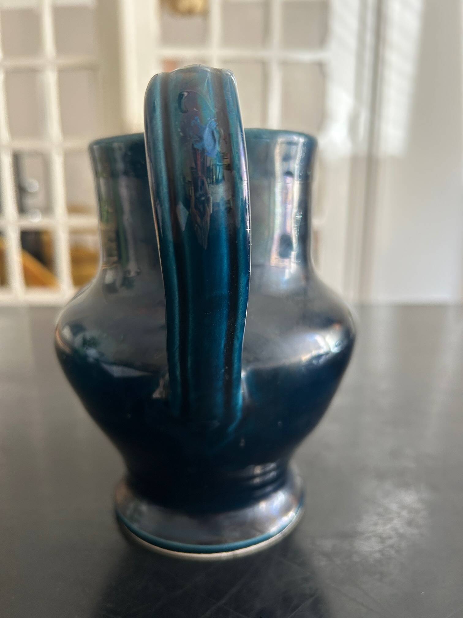 blue pitcher the potter chin