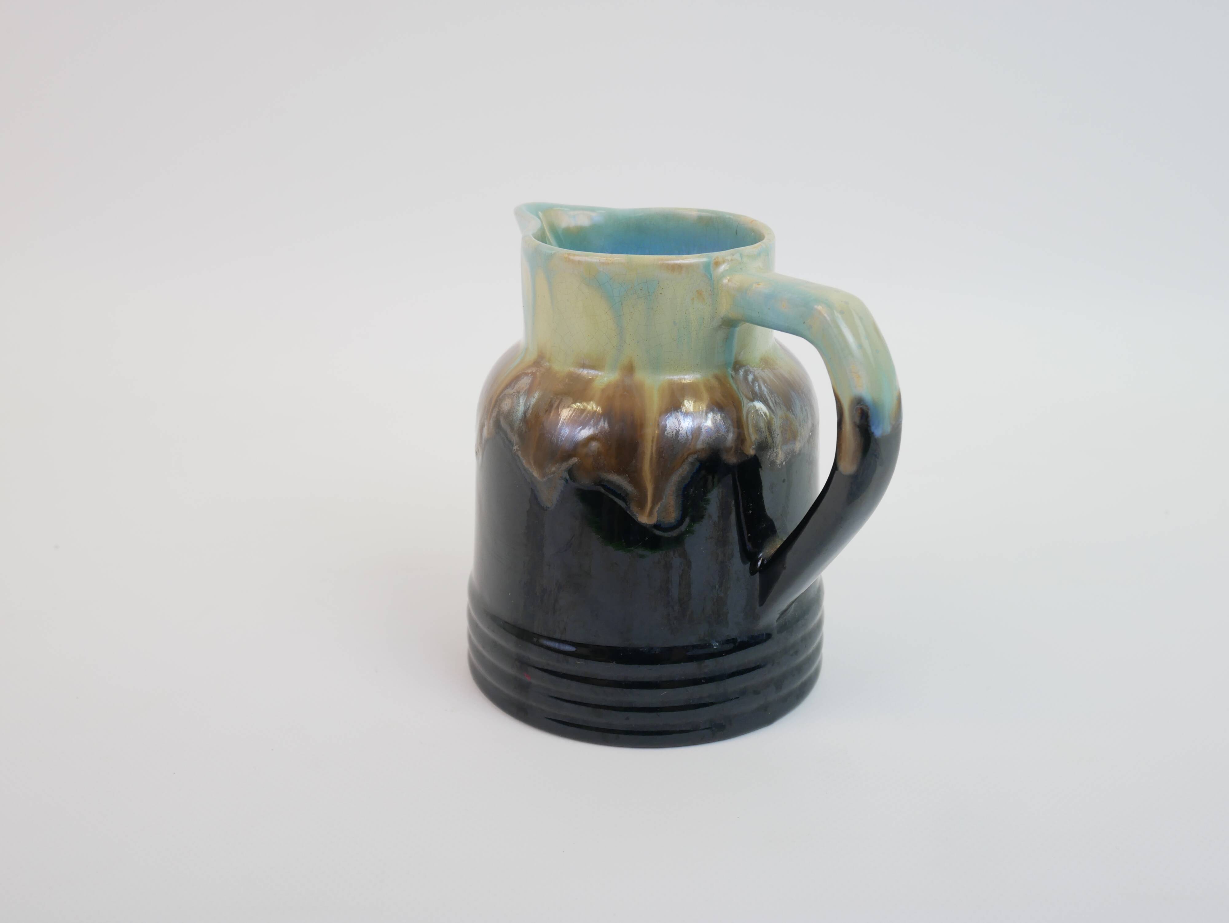 Art Deco pitcher in black, brown and blue glazed ceramic