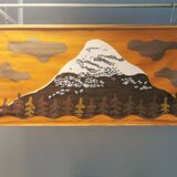 Beautiful wall-mounted Swedish fabric print with motifs of mountains, reindeer and more.