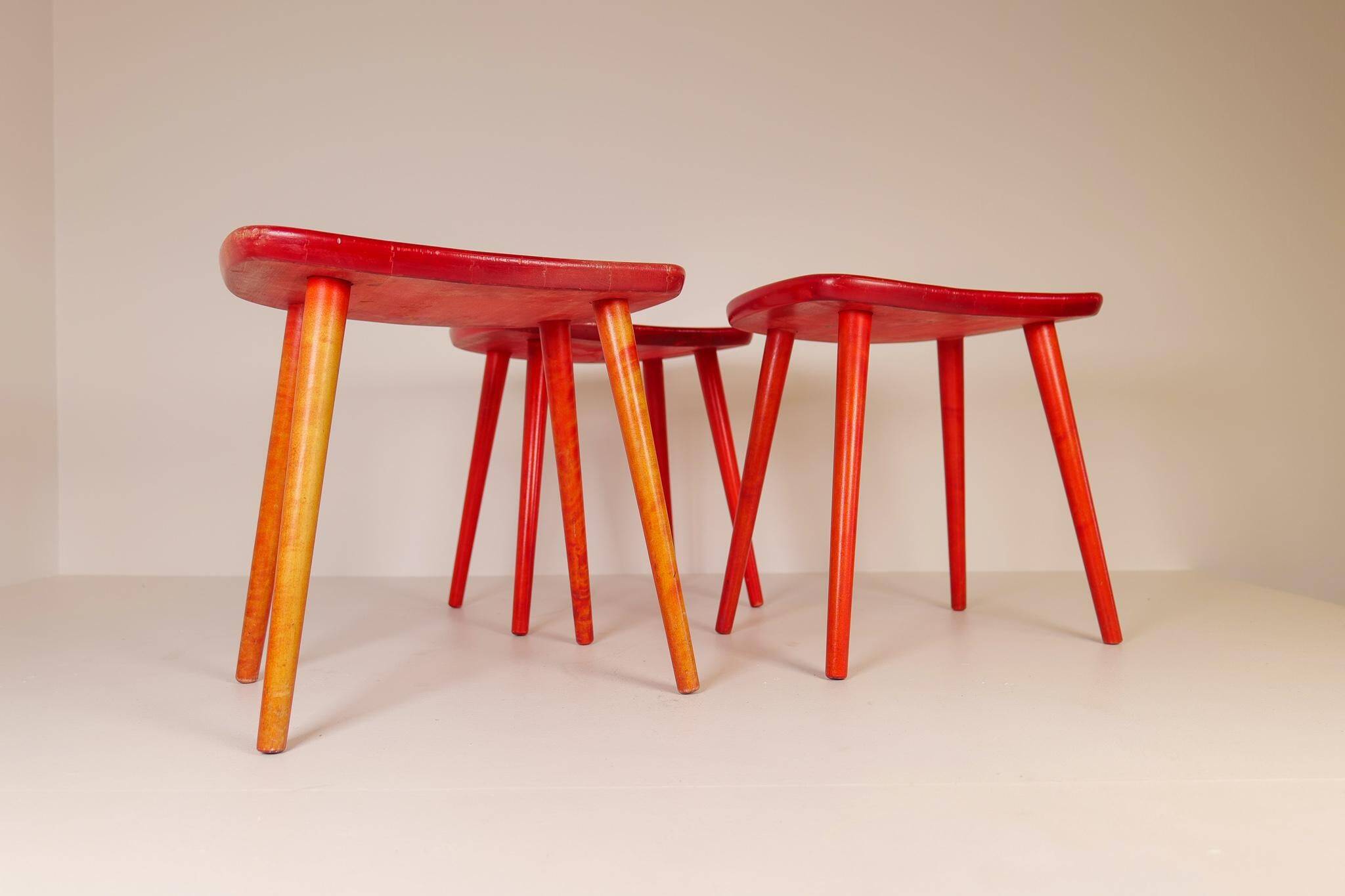 Swedish stools in red lacquered birch, Yngve Ekström "Palle", 1970s
