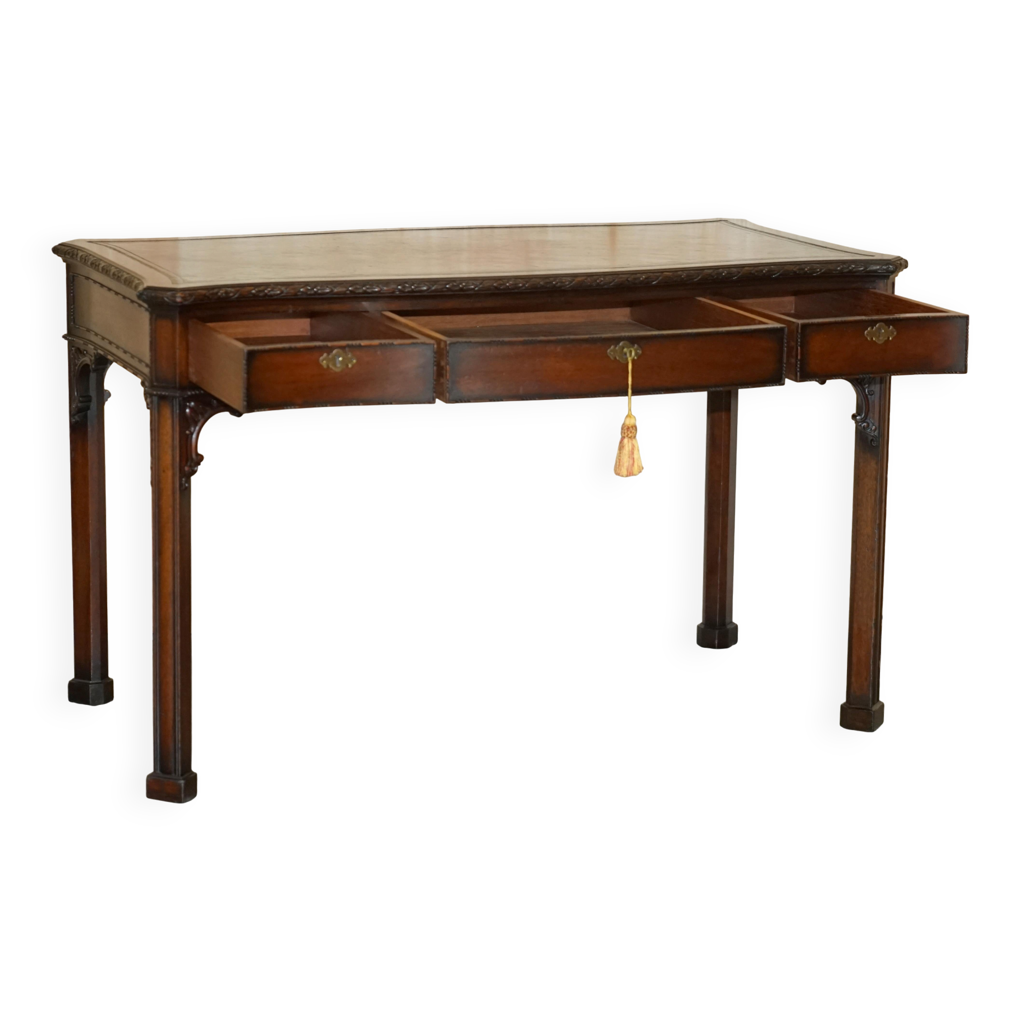 WARING & GILLOW library desk in the style of Thomas Chippendale with a leather top.